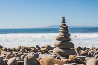 stack rock on seashore by Jeremy Thomas courtesy of Unsplash.